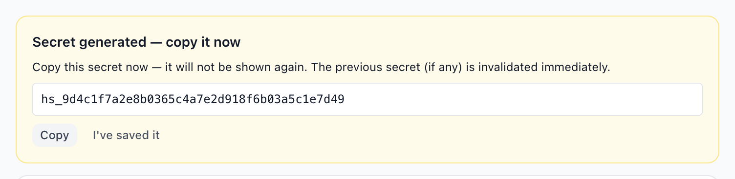 The one-time panel showing the generated signing secret, with a copy button